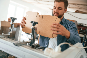 adult-male-assembling-packaging-boxes-in-a-factory-2026-09-24-06-54-51-utc