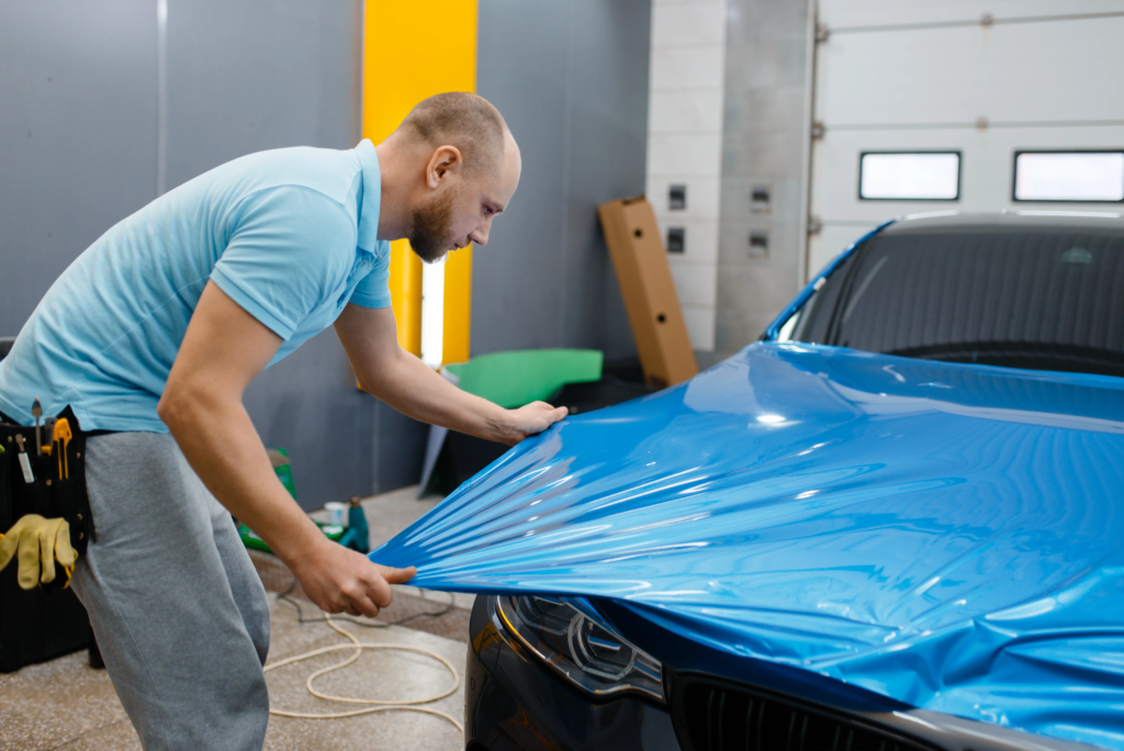 professional-applying-protective-film-on-new-car-h-2026-09-22-21-46-16-utc